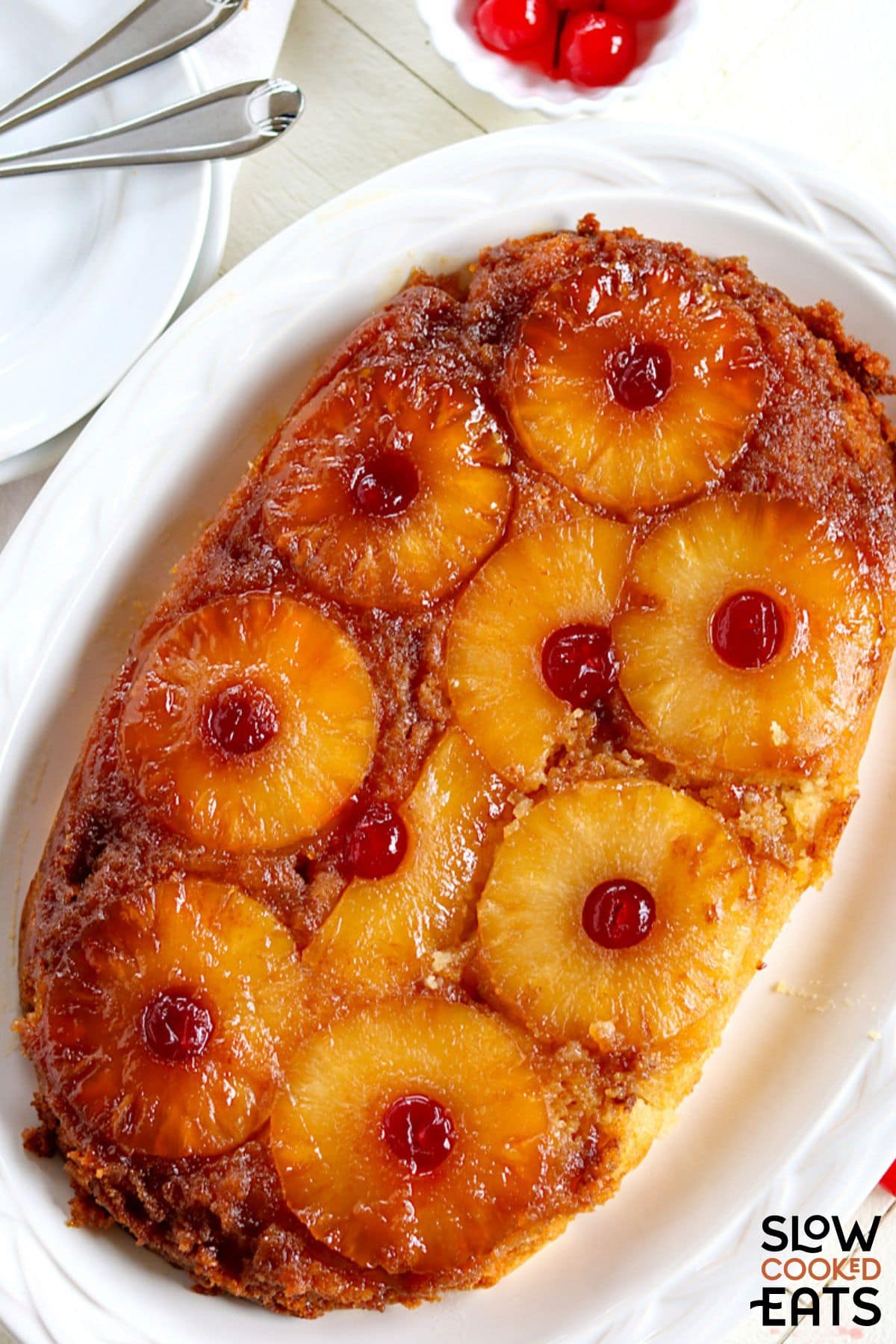 Crock pot pineapple upside down cake being served.