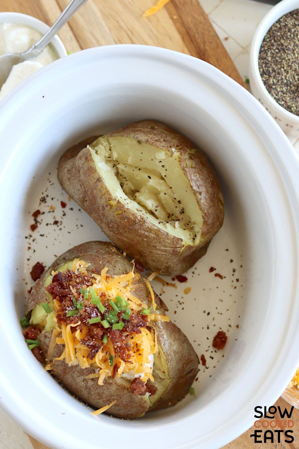 Slow cooker baked potatoes without foil with toppings.