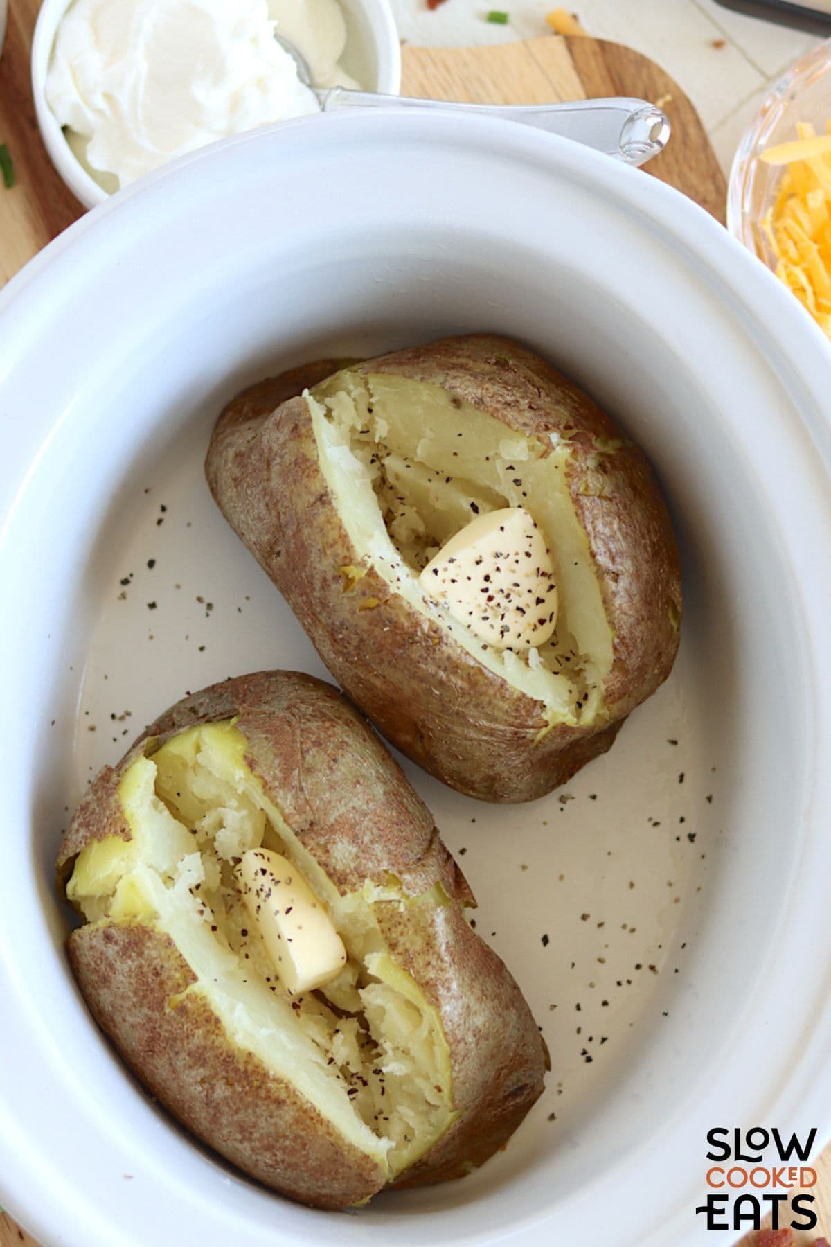 Slow cooker baked potatoes without foil in the crockpot.