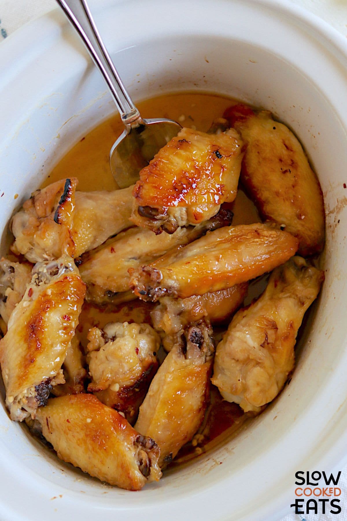 Garlic honey chicken wings in crockpot.