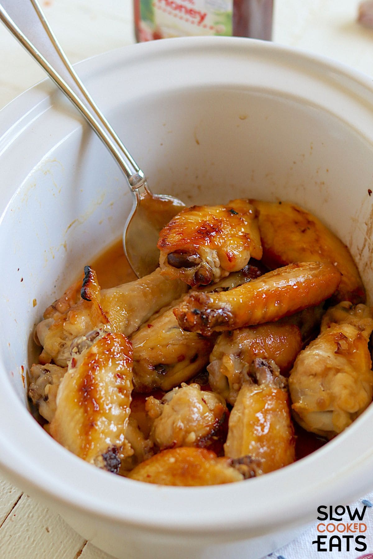 Slow cooker chicken wings with honey garlic sauce.