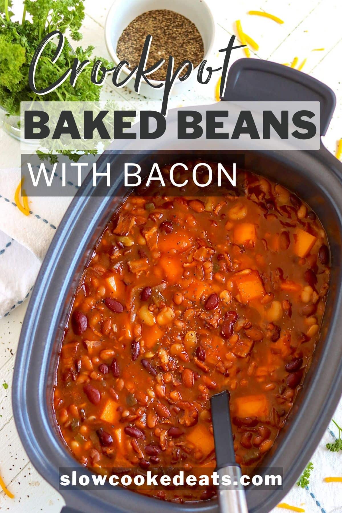 Pinterest pin with a black oval crock pot full of baked beans with melting cheese.