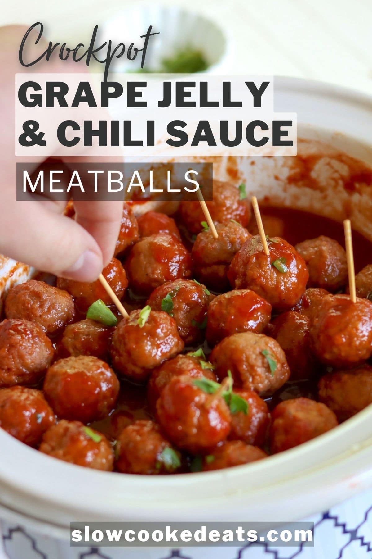 Pinterest pin with an oval white crockpot full of grape jelly and chili sauce meatballs.