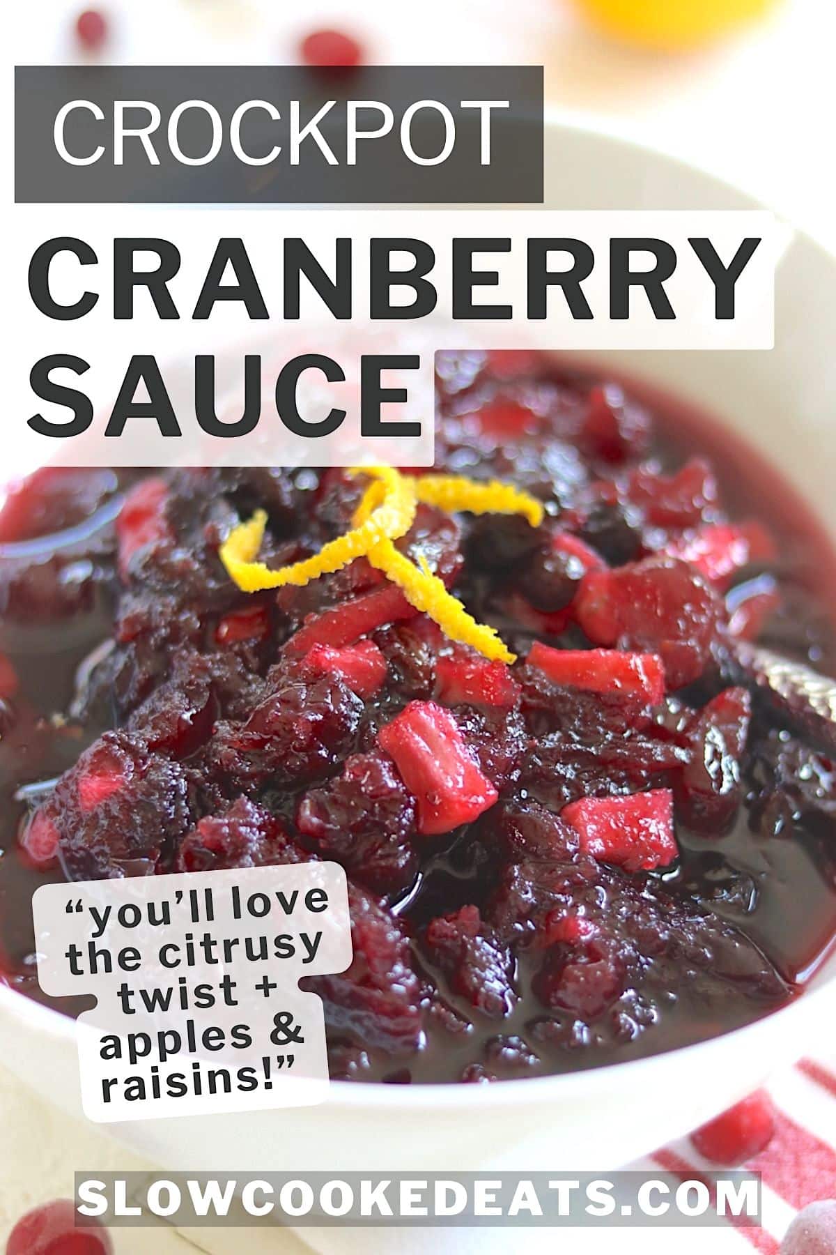 Crockpot cranberry sauce served in a white bowl and garnished with orange zest.