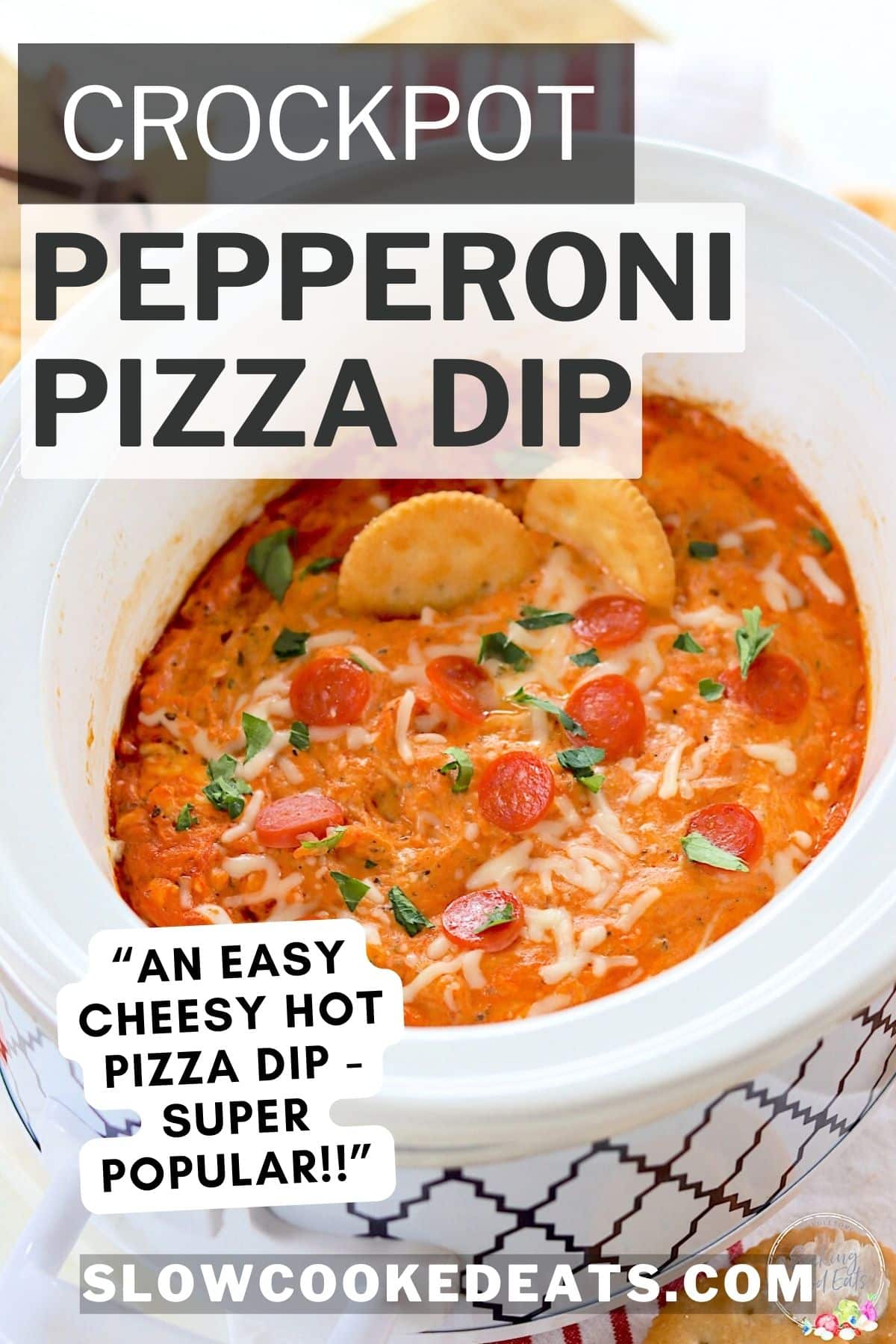 Crockpot pizza dip in an oval white slow cooker.