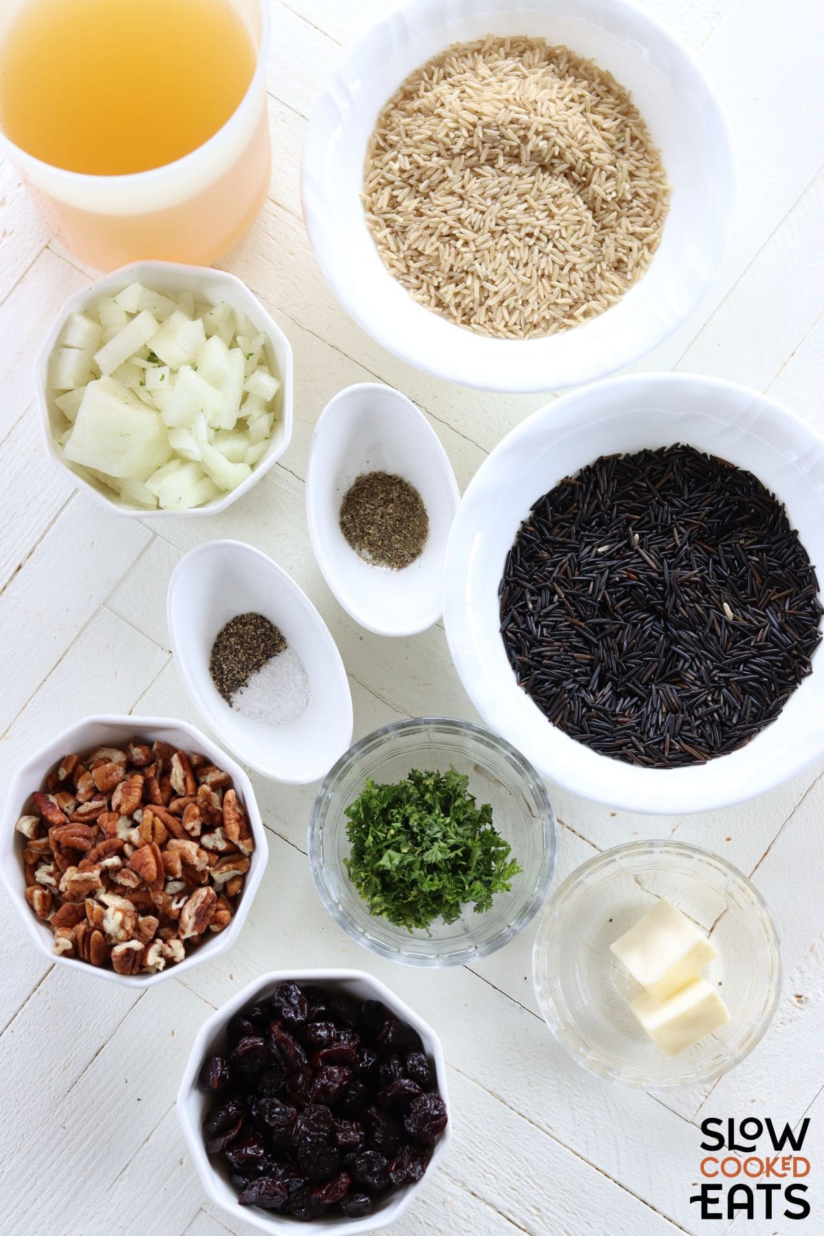 Ingredients needed for brown rice pilaf with cranberries.