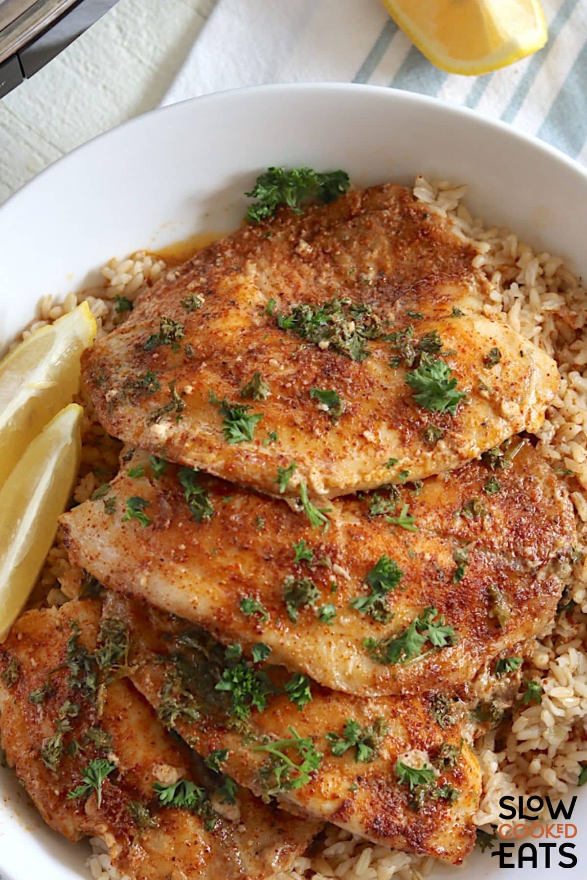 Plate of tilapia with garlic and lemon butter.