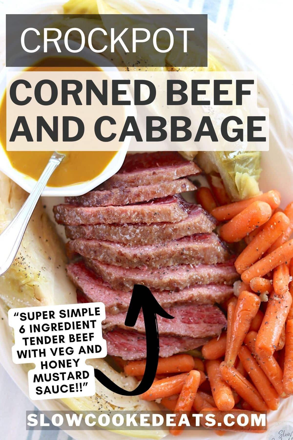 Sliced crockpot corned beef and cabbage with carrots on a white platter.