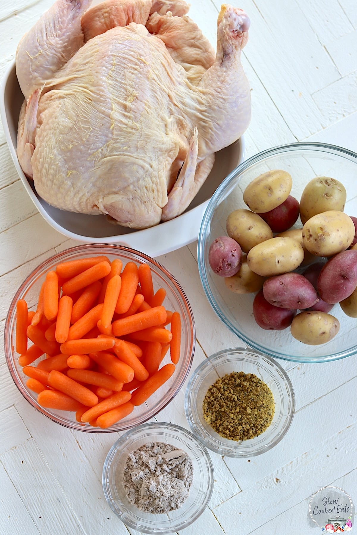 Ingredients needed for make this recipe for whole chicken in a crockpot with carrots and potatoes.