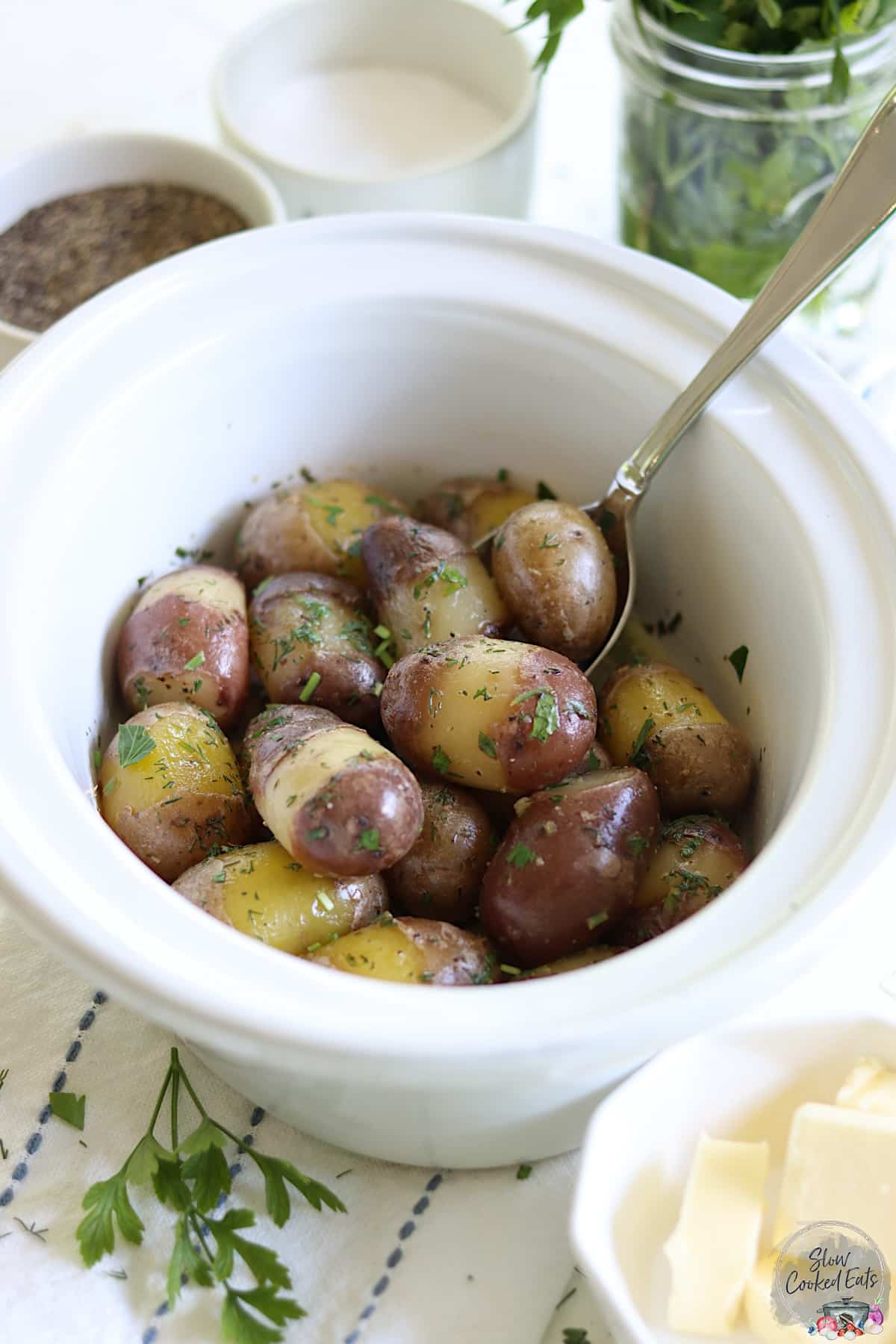 Crockpot baby red potatoes with fresh herbs and butter.