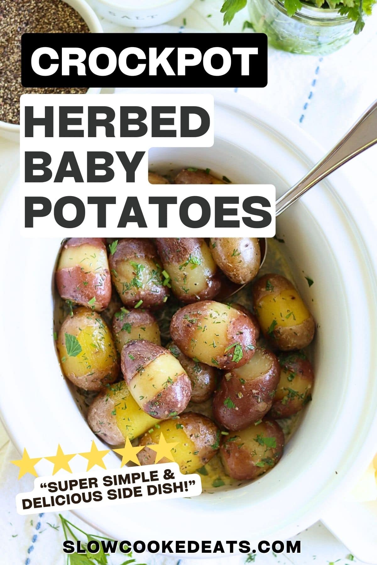 A white slow cooker with partially peeled red baby potatoes and fresh herbs.