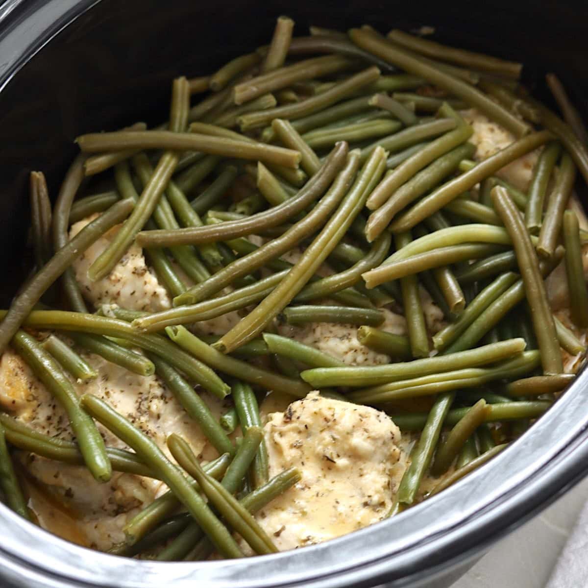Finished slow cooker garlic parmesan chicken and potatoes with green beans.