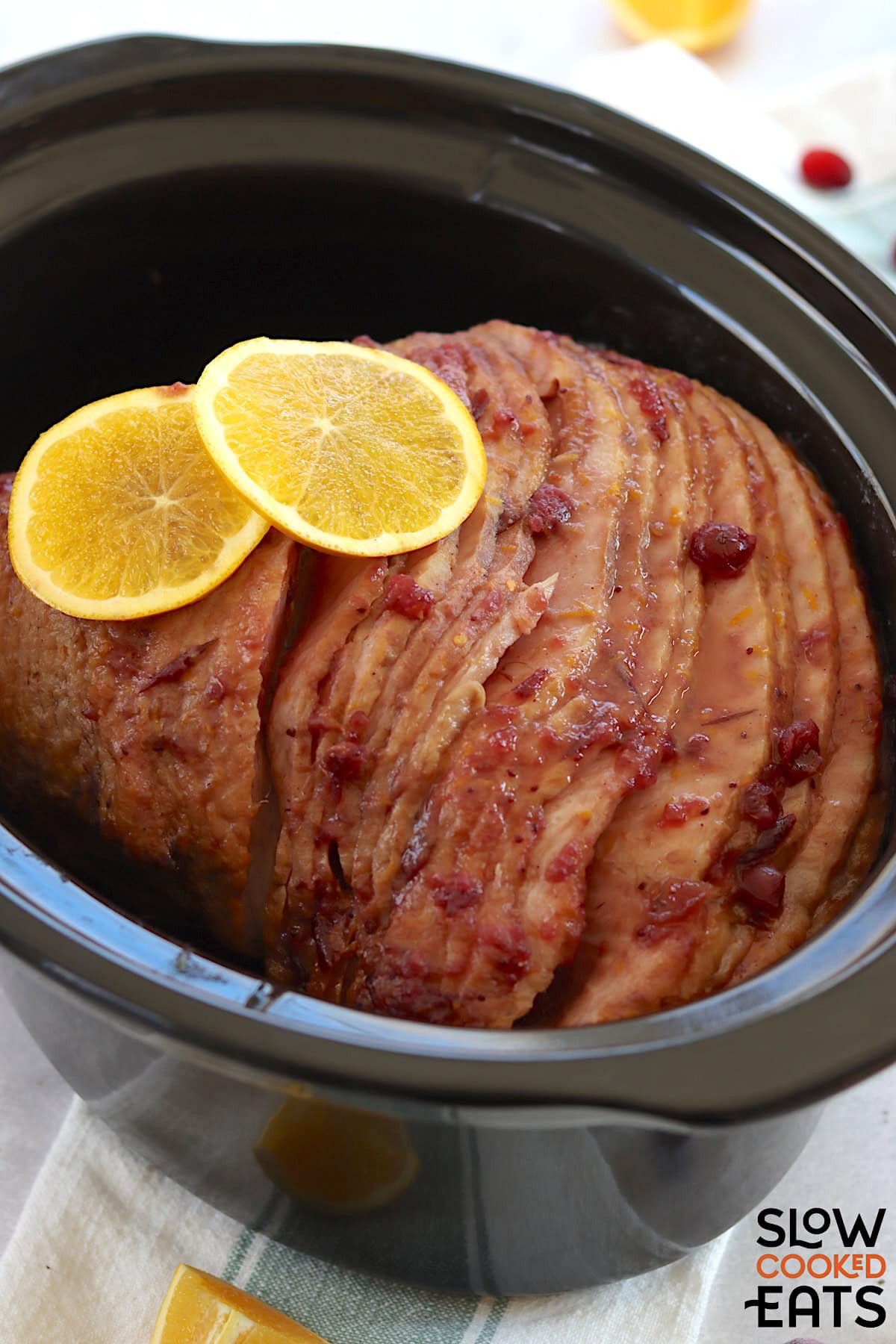 Cranberry orange spiral sliced bone-in ham in a crockpot.