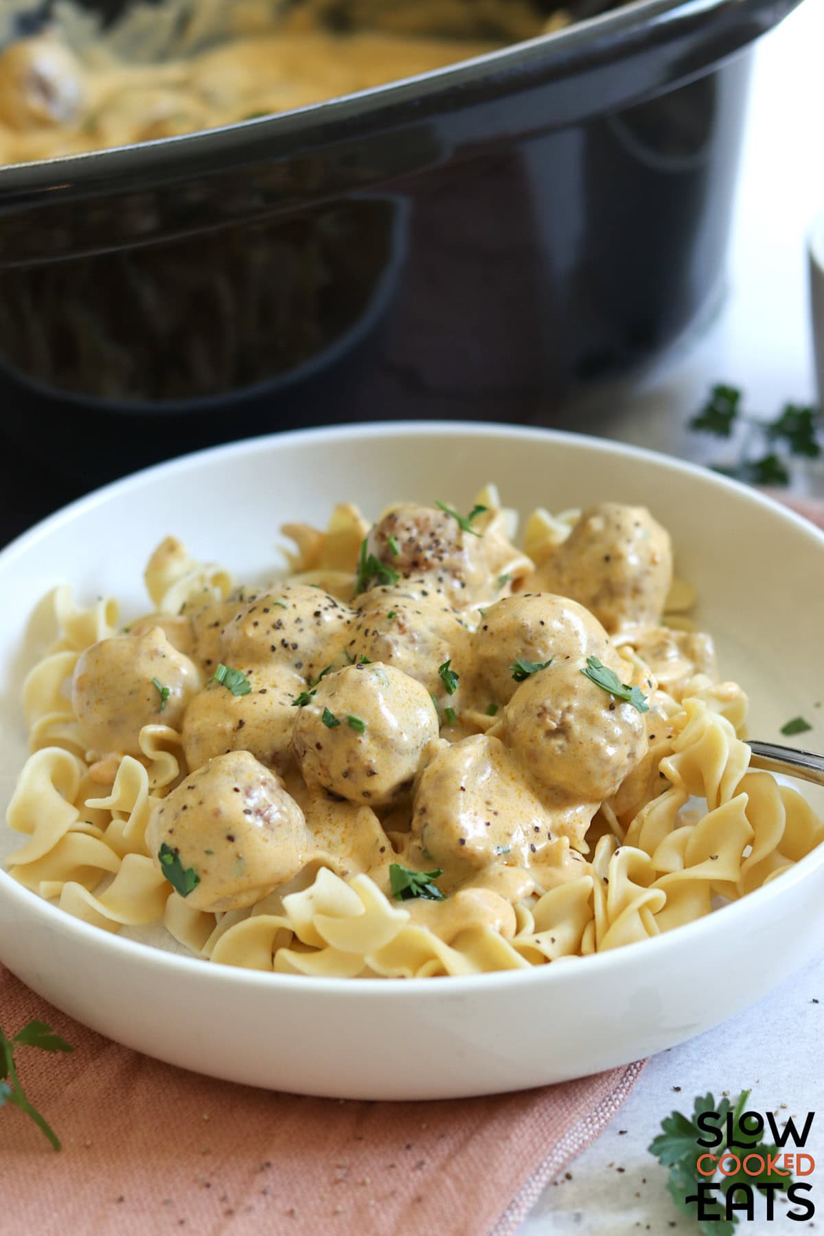 Swedish meatballs crockpot recipe served in a white bowl.