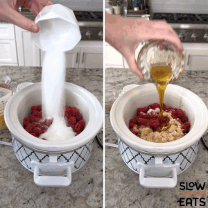 Adding berries, sugars and maple syrup to a white oval slow cooker to make raspberry cranberry sauce crockpot recipe.