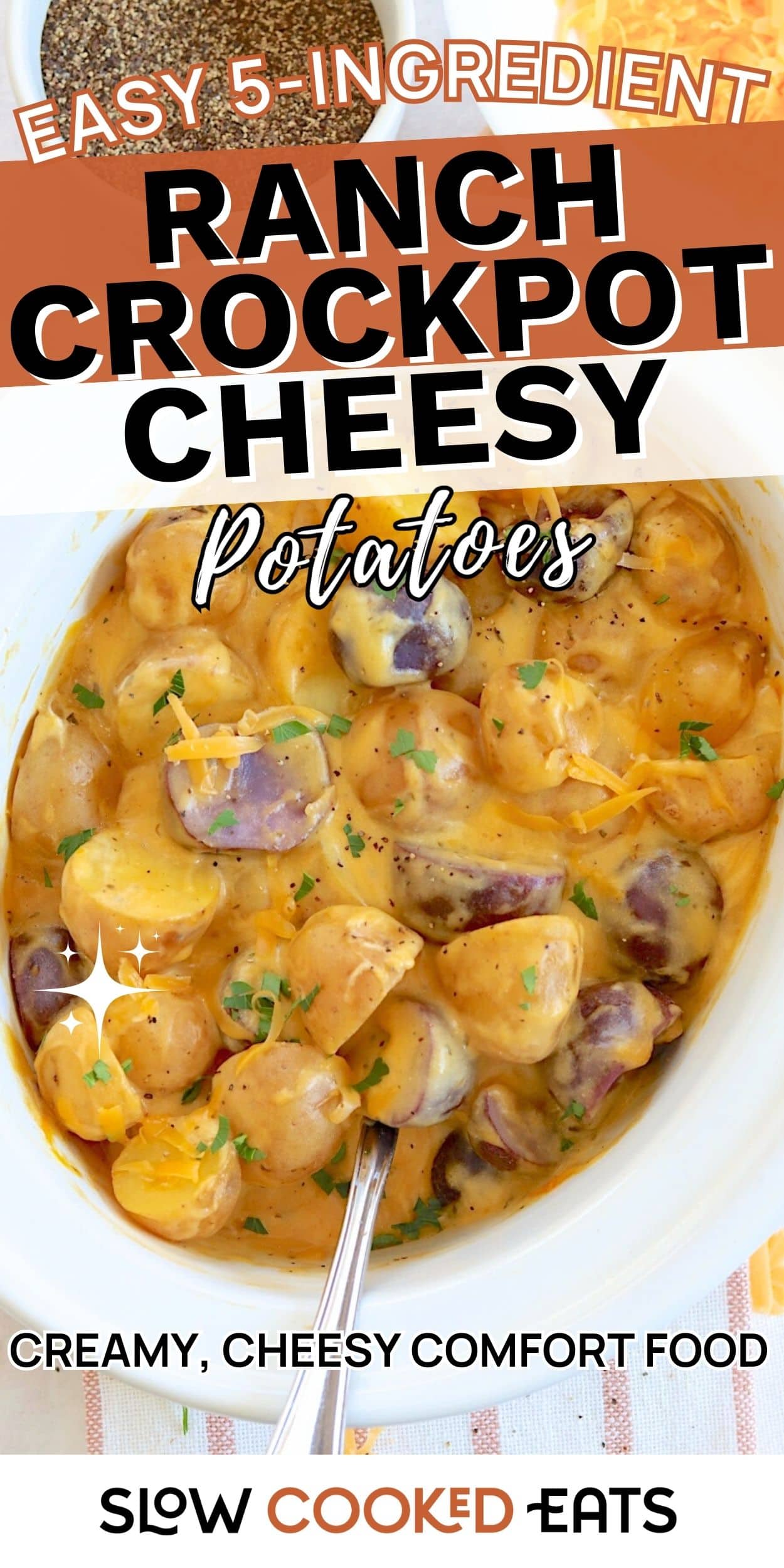 Creamy ranch crockpot cheesy potatoes made with baby potatoes and melted cheese in a slow cooker. A close-up of cheesy potatoes in a crockpot-style dish ready to serve.