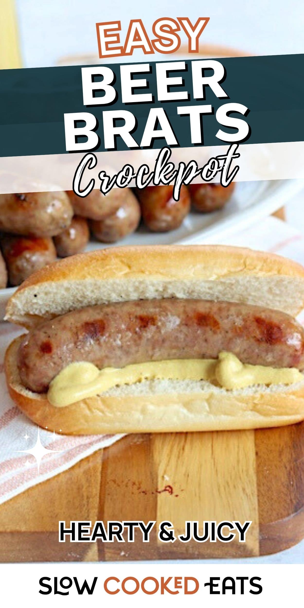 A bratwurst in a bun with mustard sits on a wooden board, with more cooked brats in the background. This beer brats crockpot recipe pin highlights an easy slow cooker brat meal.
